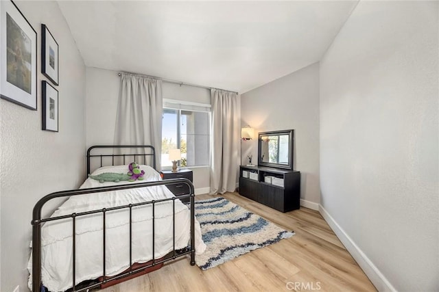 26925 Jasper Unit 210, Mission Viejo, CA 92691 - bedroom featuring multiple windows and wood finished floors