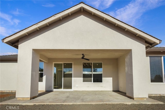 6779 Matell Rd, Paradise, CA 95969 - rear view of house featuring a ceiling fan, stucco siding, and a patio area