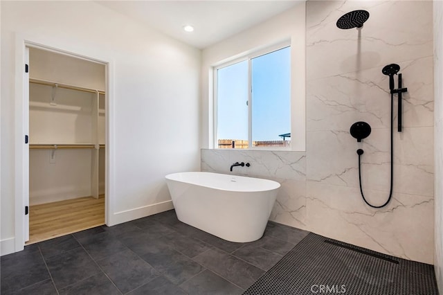 6779 Matell Rd, Paradise, CA 95969 - bathroom featuring tile walls, a marble finish shower, a soaking tub, a spacious closet, and recessed lighting