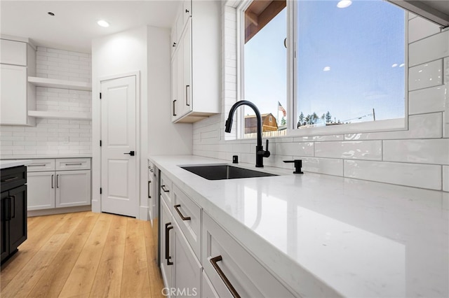 6779 Matell Rd, Paradise, CA 95969 - kitchen with tasteful backsplash, open shelves, light stone countertops, light wood-style floors, and recessed lighting