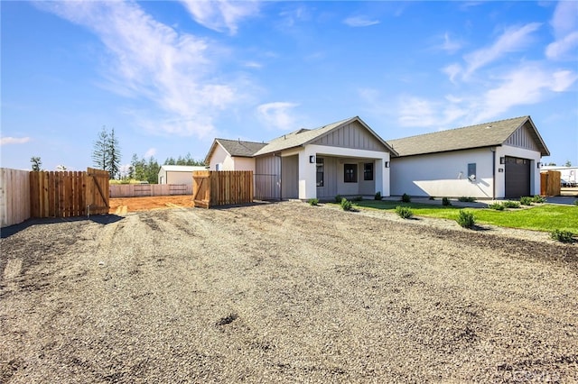 6779 Matell Rd, Paradise, CA 95969 - view of front of property featuring a garage, driveway, board and batten siding, and a shingled roof