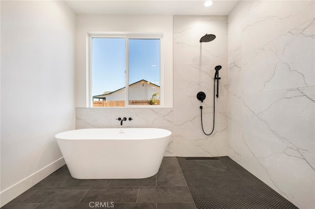 6779 Matell Rd, Paradise, CA 95969 - full bath featuring a marble finish shower, a freestanding bath, tile walls, and tile patterned floors