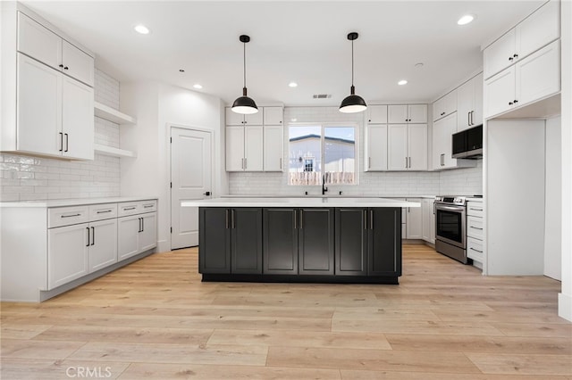 6779 Matell Rd, Paradise, CA 95969 - kitchen featuring stainless steel range with electric cooktop, open shelves, backsplash, light countertops, and recessed lighting
