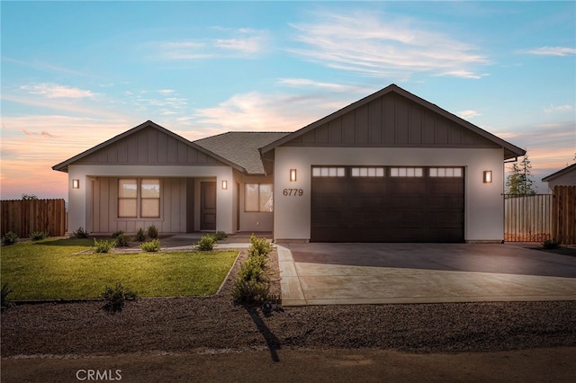 6779 Matell Rd, Paradise, CA 95969 - view of front facade featuring driveway, a garage, board and batten siding, and roof with shingles