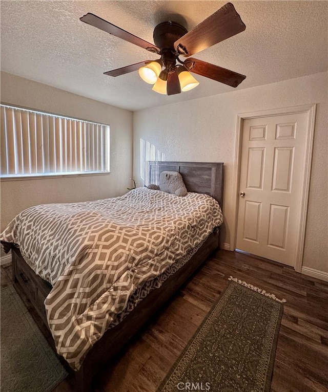 751 Yucca Ave, Barstow, CA 92311 - bedroom featuring wood finished floors, a textured ceiling, and ceiling fan