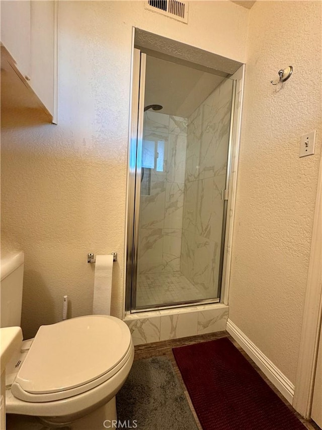 751 Yucca Ave, Barstow, CA 92311 - bathroom with a shower stall and a textured wall