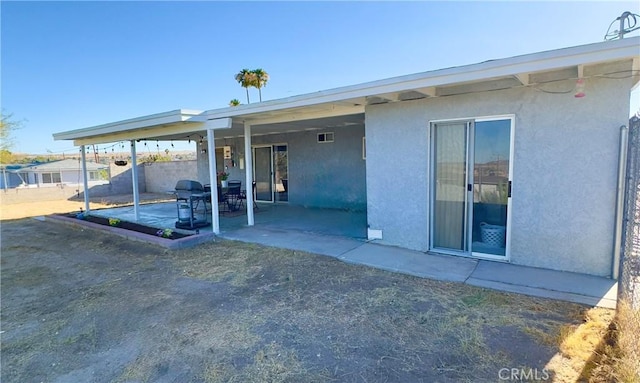 751 Yucca Ave, Barstow, CA 92311 - back of property featuring stucco siding and a patio area
