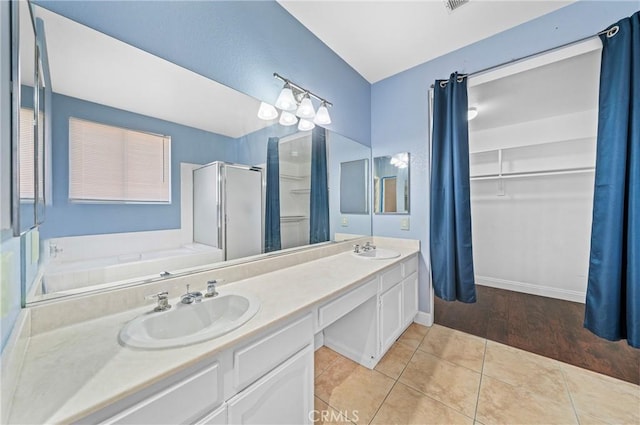 39647 Dartanian Pl, Murrieta, CA 92562 - full bathroom featuring a stall shower, a garden tub, double vanity, and tile patterned floors
