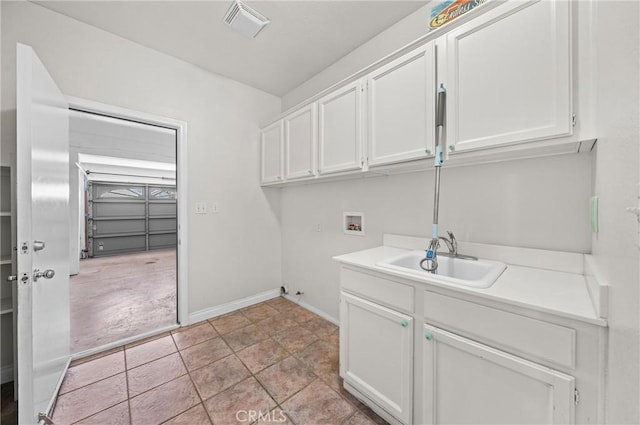 39647 Dartanian Pl, Murrieta, CA 92562 - laundry room featuring hookup for a washing machine, cabinet space, and light tile patterned flooring