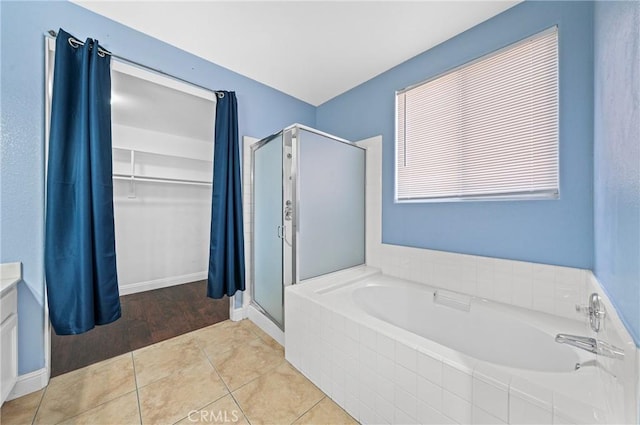 39647 Dartanian Pl, Murrieta, CA 92562 - bathroom with a shower stall, a garden tub, tile patterned floors, and vanity