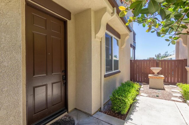 2078 Aviata Rd Unit 70, Chula Vista, CA 91914 - view of exterior entry with stucco siding and a patio