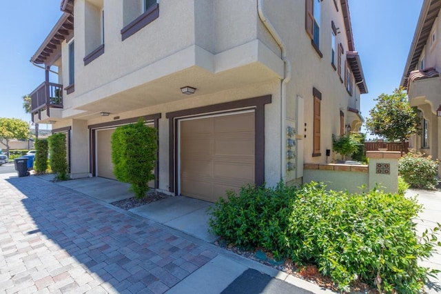 2078 Aviata Rd Unit 70, Chula Vista, CA 91914 - doorway to property with a garage and stucco siding