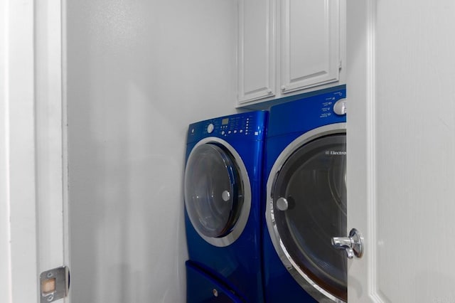 2078 Aviata Rd Unit 70, Chula Vista, CA 91914 - washroom with washing machine and dryer and cabinet space