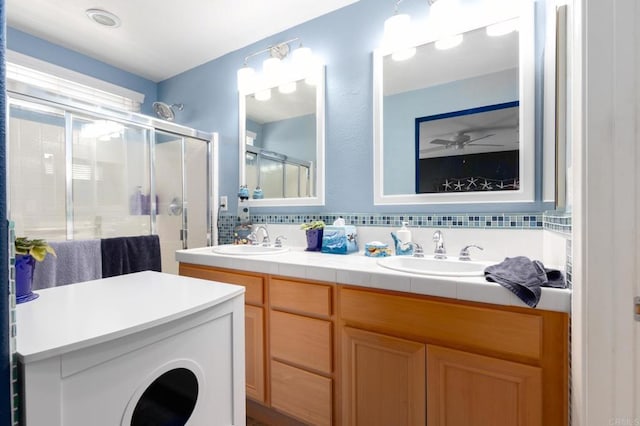 2078 Aviata Rd Unit 70, Chula Vista, CA 91914 - bathroom with decorative backsplash, double vanity, and a stall shower