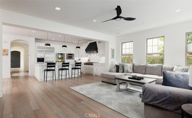 21 Via Nerisa, San Clemente, CA 92673 - living room with ceiling fan, recessed lighting, plenty of natural light, arched walkways, and light wood-type flooring