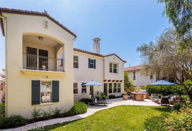 21 Via Nerisa, San Clemente, CA 92673 - rear view of house featuring stucco siding, a yard, and a chimney
