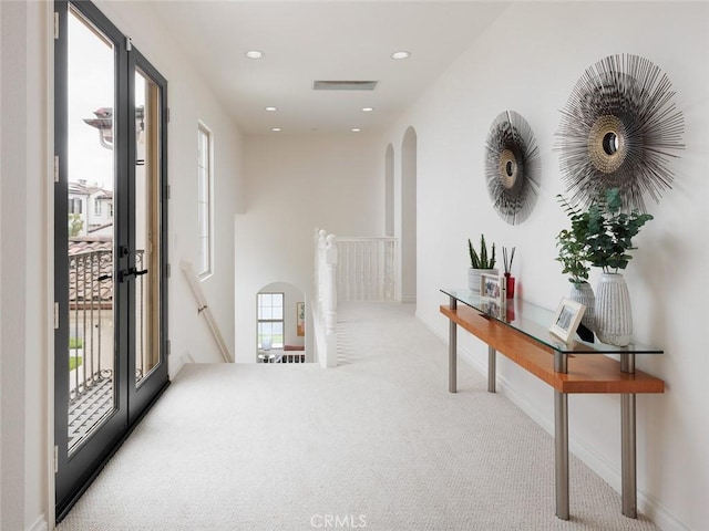 21 Via Nerisa, San Clemente, CA 92673 - hallway with an upstairs landing, carpet flooring, arched walkways, and recessed lighting