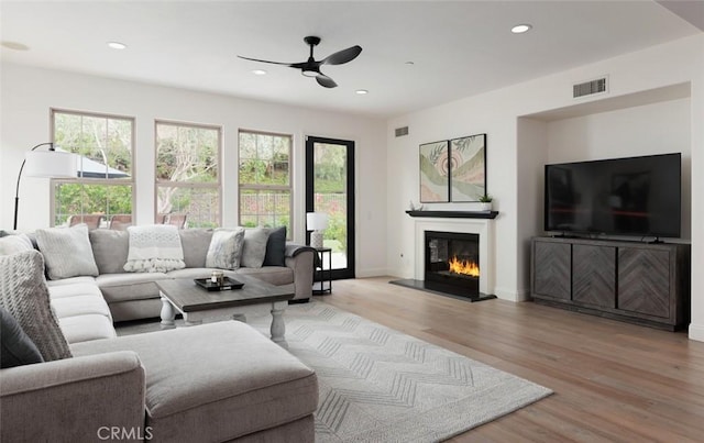21 Via Nerisa, San Clemente, CA 92673 - living room with a ceiling fan, light wood-type flooring, a glass covered fireplace, and recessed lighting