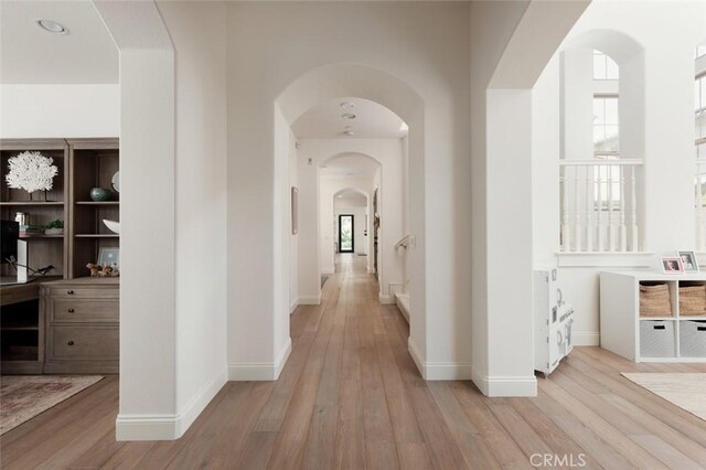 21 Via Nerisa, San Clemente, CA 92673 - hall with light wood-style flooring, arched walkways, and plenty of natural light