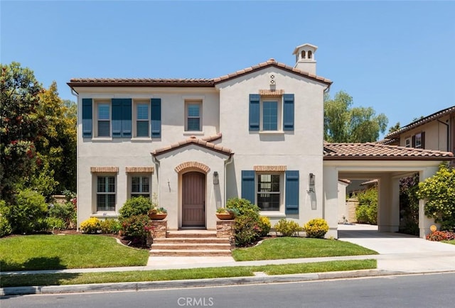 21 Via Nerisa, San Clemente, CA 92673 - mediterranean / spanish house with stucco siding, a tile roof, a front yard, concrete driveway, and a carport