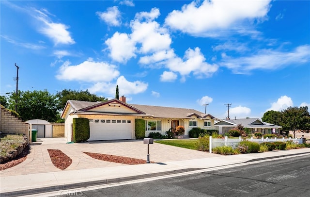 1128 Aldersgate Dr, La Verne, CA 91750 - ranch-style home featuring decorative driveway, a garage, a chimney, and a gate