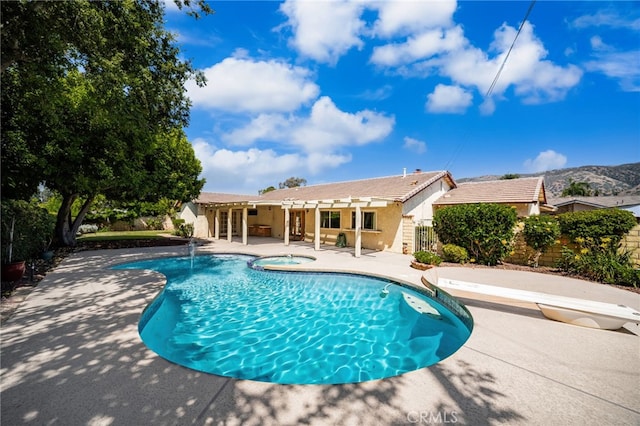 1128 Aldersgate Dr, La Verne, CA 91750 - view of swimming pool featuring a patio area, a diving board, and a pool with connected hot tub