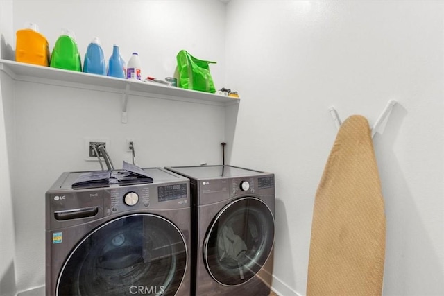 15958 Lasselle St Unit 2, Moreno Valley, CA 92551 - washroom featuring washing machine and dryer and baseboards