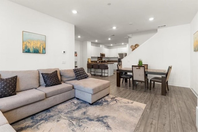 15958 Lasselle St Unit 2, Moreno Valley, CA 92551 - living room with light wood-style flooring and recessed lighting