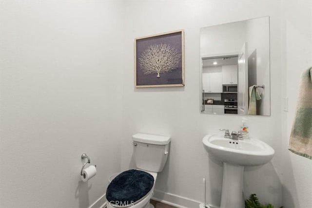 15958 Lasselle St Unit 2, Moreno Valley, CA 92551 - half bathroom with toilet and baseboards