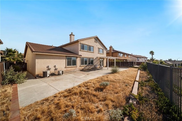 15453 La Casa Dr, Moreno Valley, CA 92555 - rear view of house with a patio, a fenced backyard, stucco siding, a pergola, and a chimney