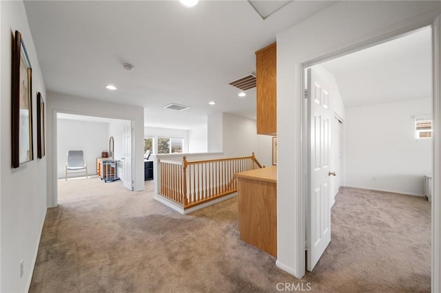 15453 La Casa Dr, Moreno Valley, CA 92555 - corridor with light carpet, an upstairs landing, and recessed lighting