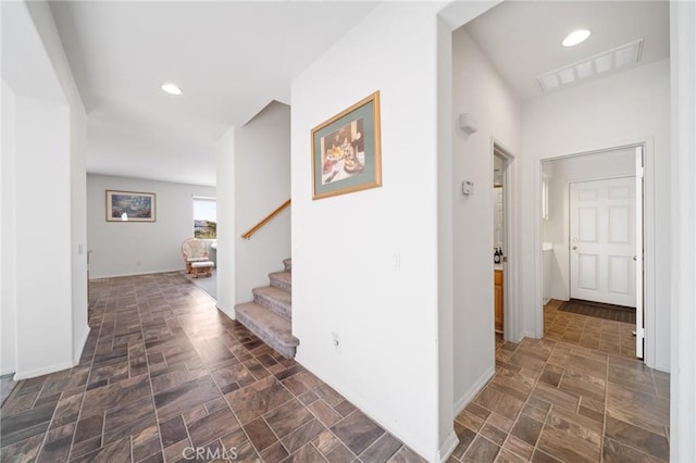 15453 La Casa Dr, Moreno Valley, CA 92555 - corridor featuring stairway, stone finish floors, and recessed lighting