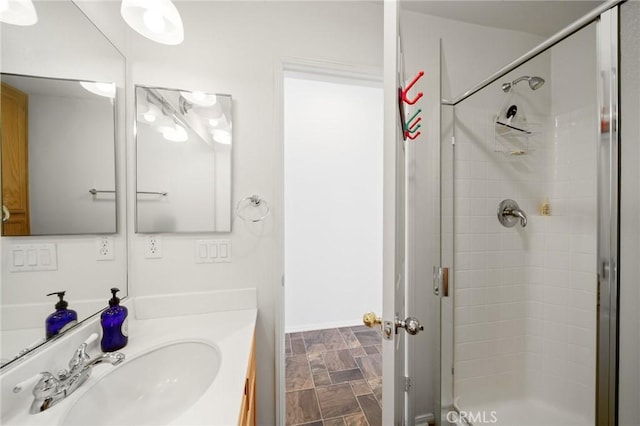 15453 La Casa Dr, Moreno Valley, CA 92555 - bathroom featuring a shower stall, vanity, and stone finish flooring