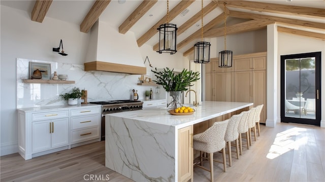 1901 Mariners Dr, Newport Beach, CA 92660 - kitchen featuring high end stainless steel range, custom exhaust hood, light stone countertops, backsplash, and open shelves