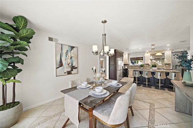 9168 El Azul Cir, Fountain Valley, CA 92708 - dining room featuring light tile patterned floors, a chandelier, and inlaid floor details