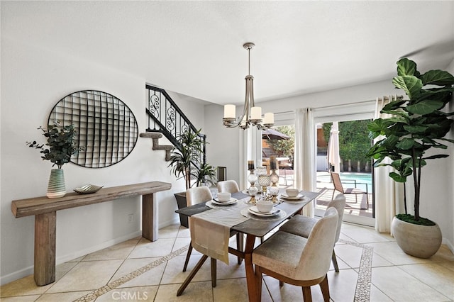9168 El Azul Cir, Fountain Valley, CA 92708 - dining room featuring inlaid floor details, light tile patterned floors, a chandelier, and stairway