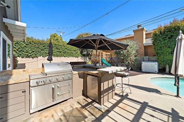 9168 El Azul Cir, Fountain Valley, CA 92708 - fenced backyard with area for grilling, an outdoor bar, a patio, and a playground