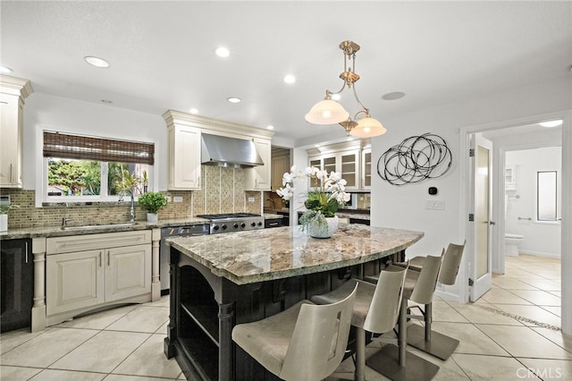 9168 El Azul Cir, Fountain Valley, CA 92708 - kitchen with wall chimney range hood, dishwashing machine, light tile patterned flooring, decorative backsplash, and recessed lighting