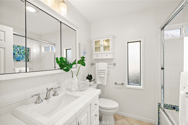 9168 El Azul Cir, Fountain Valley, CA 92708 - bathroom with vanity, shower / bath combination with glass door, and tile patterned flooring