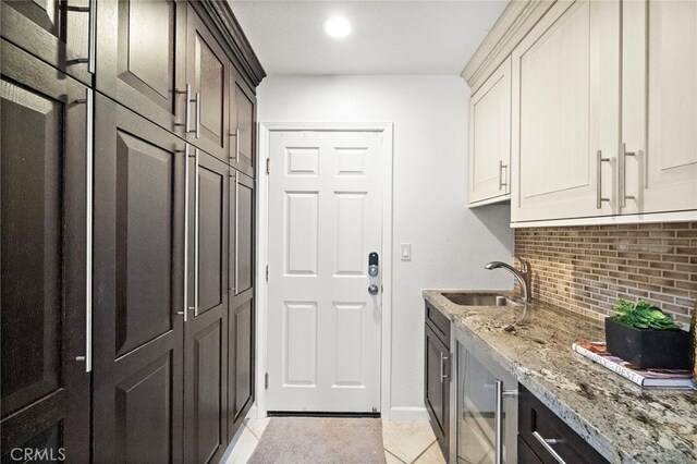 9168 El Azul Cir, Fountain Valley, CA 92708 - laundry room featuring light tile patterned flooring and beverage cooler
