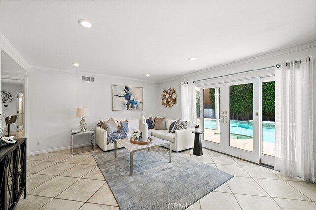 9168 El Azul Cir, Fountain Valley, CA 92708 - living area featuring ornamental molding, french doors, light tile patterned floors, and recessed lighting