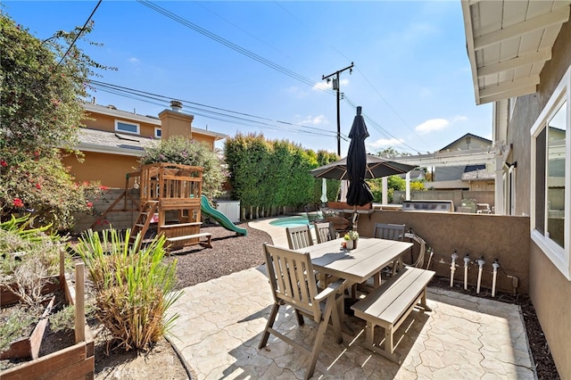 9168 El Azul Cir, Fountain Valley, CA 92708 - fenced backyard with a patio, outdoor dining area, and a playground