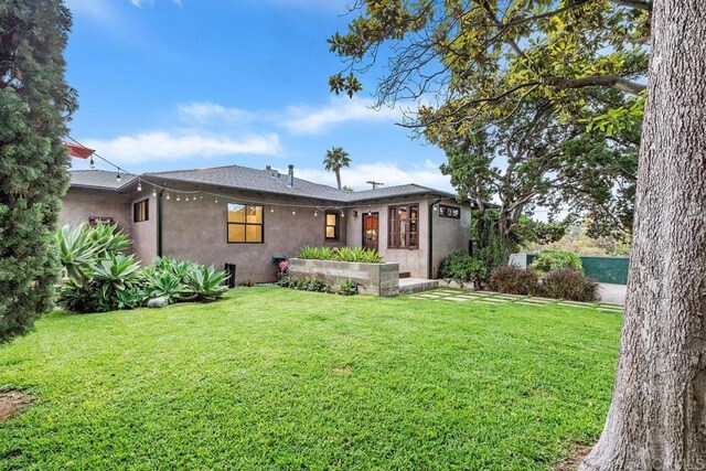 860 Nardo Rd, Encinitas, CA 92024 - view of front of house featuring stucco siding and a front lawn