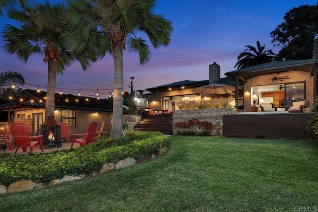 860 Nardo Rd, Encinitas, CA 92024 - view of grassy yard featuring a fire pit, a ceiling fan, and a patio area