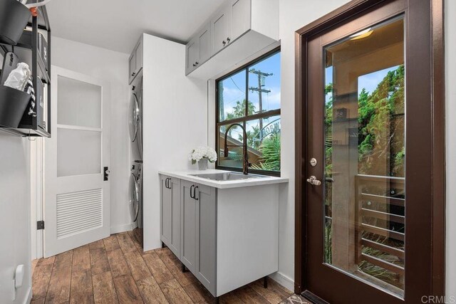 860 Nardo Rd, Encinitas, CA 92024 - doorway featuring estacked washer and dryer and dark wood-style flooring