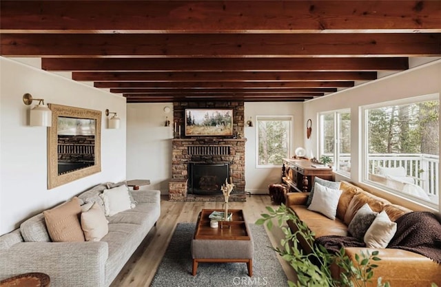 521 Sunderland Ct, Lake Arrowhead, CA 92352 - living area featuring a fireplace, plenty of natural light, beam ceiling, and wood finished floors
