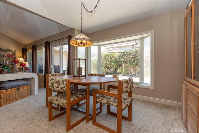 31032 Via Estenaga, San Juan Capistrano, CA 92675 - dining space with a chandelier, healthy amount of natural light, light colored carpet, and lofted ceiling