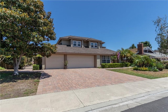 31032 Via Estenaga, San Juan Capistrano, CA 92675 - view of front of house featuring decorative driveway and a garage