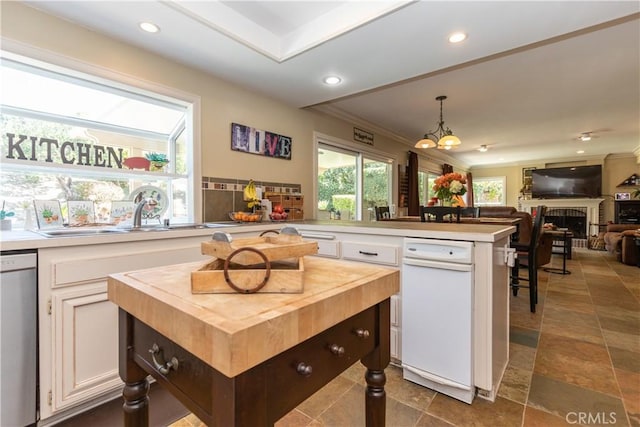 31032 Via Estenaga, San Juan Capistrano, CA 92675 - kitchen with butcher block counters, dishwasher, white cabinets, recessed lighting, and ornamental molding