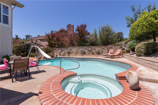 31032 Via Estenaga, San Juan Capistrano, CA 92675 - view of swimming pool with a water slide, a patio, and a pool with connected hot tub
